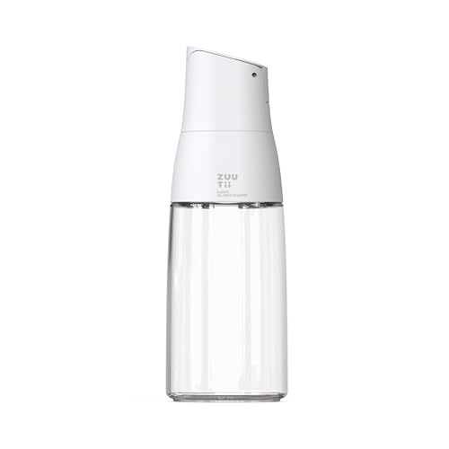 Zuutii Yukon White glass oil dispenser bottle with drip-free spout and gravity-pull auto cap, shown on a kitchen countertop